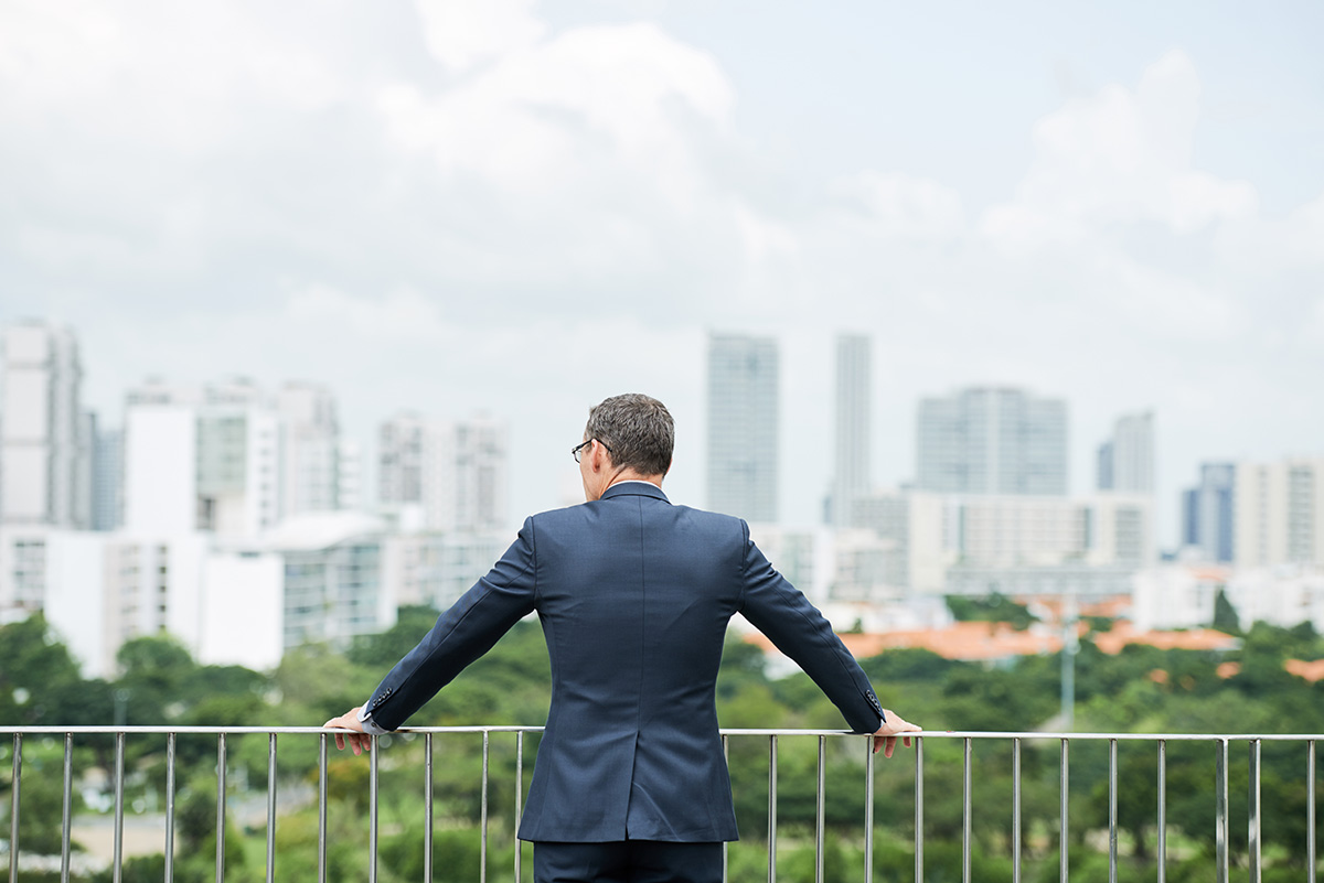 businessman looking at city
